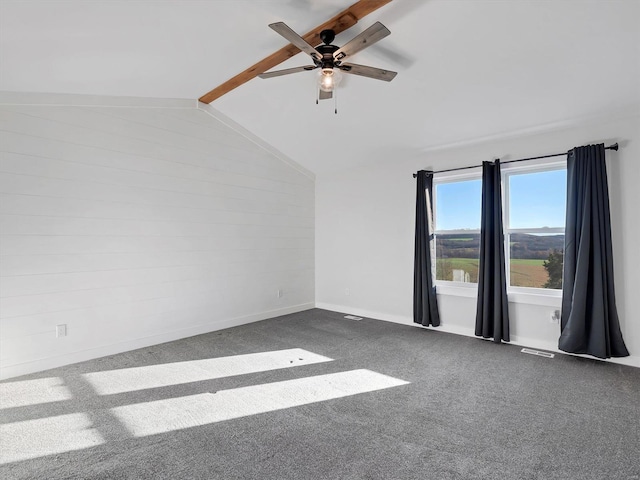 carpeted spare room featuring ceiling fan and lofted ceiling