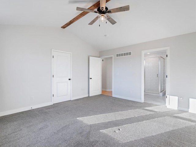 unfurnished bedroom with light carpet, connected bathroom, lofted ceiling with beams, and ceiling fan