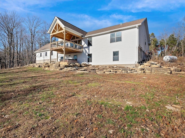 back of property with a balcony