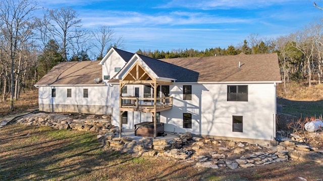 back of property with a patio and a deck