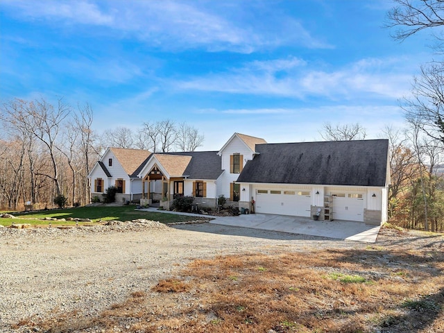 view of front of property featuring a front yard and a garage