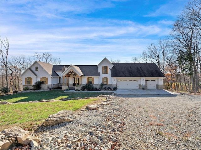 view of front of home featuring a front lawn and a garage