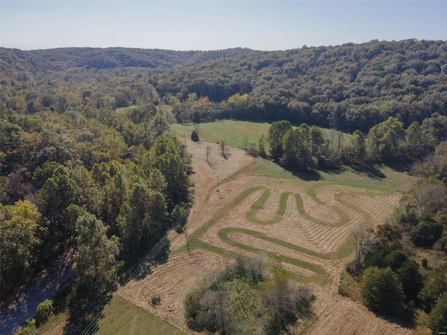 birds eye view of property with a rural view