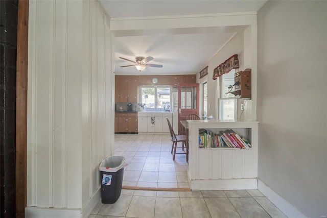 kitchen featuring ceiling fan and light tile patterned flooring