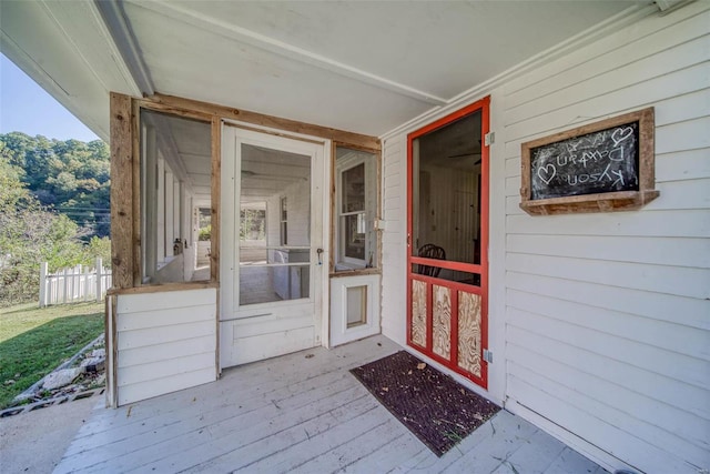 entrance to property featuring a wooden deck