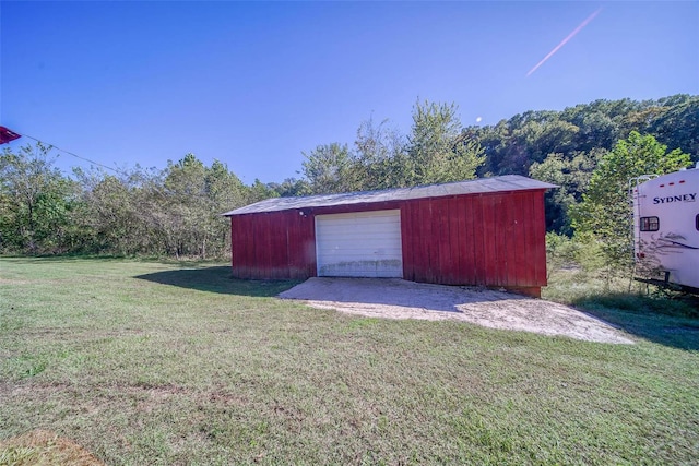 garage with a yard