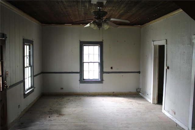 empty room with wooden ceiling and ceiling fan