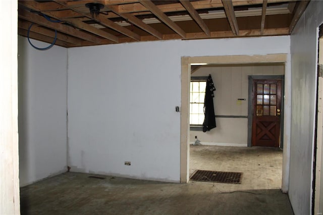 spare room with concrete flooring