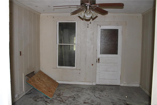 entrance to property with ceiling fan and a patio area