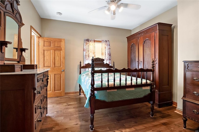 bedroom with hardwood / wood-style floors