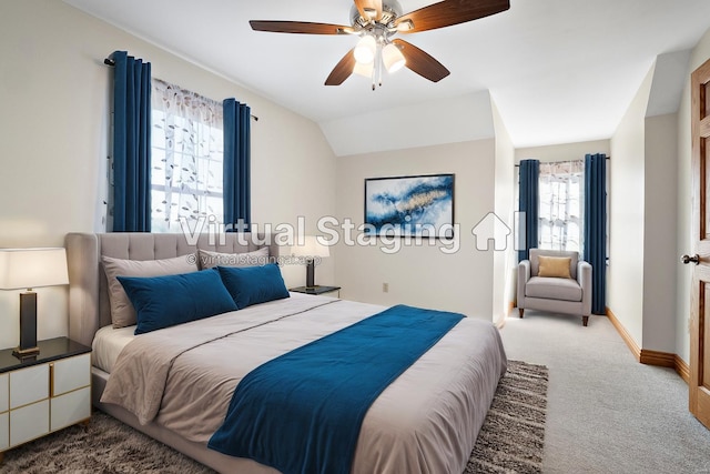 bedroom with multiple windows, lofted ceiling, light carpet, and ceiling fan