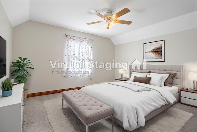 carpeted bedroom featuring ceiling fan and lofted ceiling