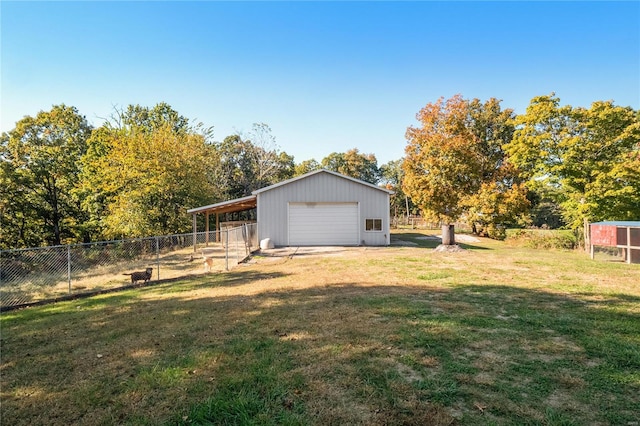 view of yard featuring an outbuilding and a garage