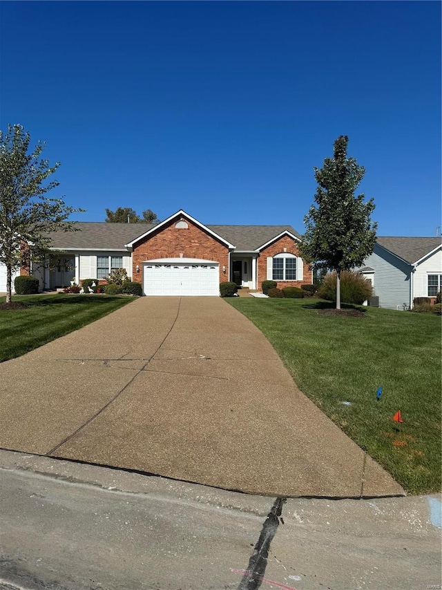 single story home featuring a front yard and a garage