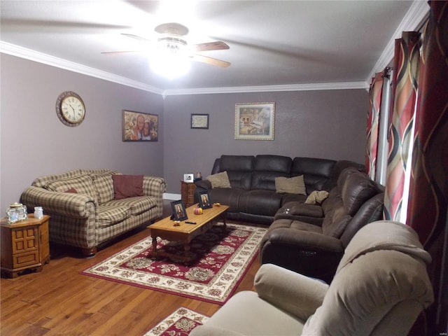 living room with wood-type flooring, ornamental molding, and ceiling fan