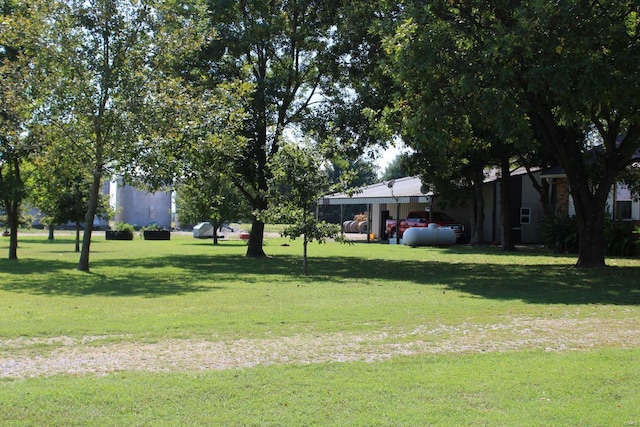 view of home's community featuring a lawn