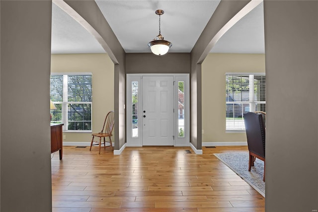 foyer with light hardwood / wood-style floors