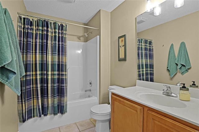 full bathroom with vanity, tile patterned flooring, a textured ceiling, shower / tub combo, and toilet