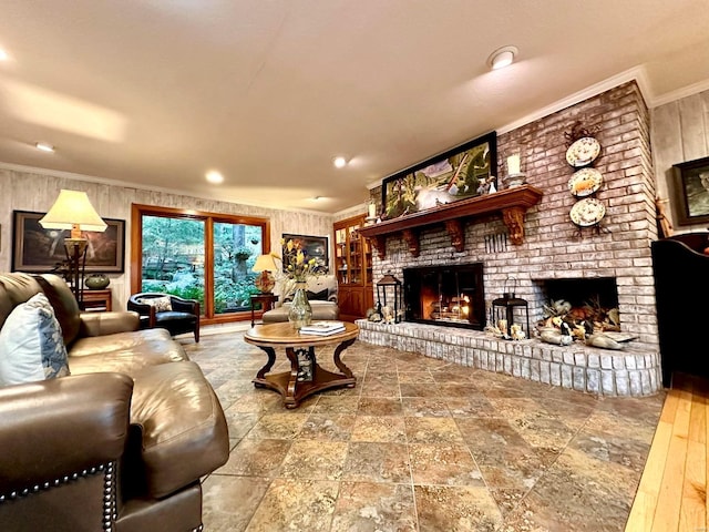 living room with a fireplace and crown molding