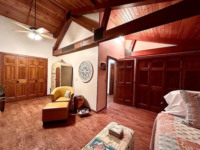 living area with wooden ceiling, ceiling fan, beamed ceiling, and hardwood / wood-style flooring