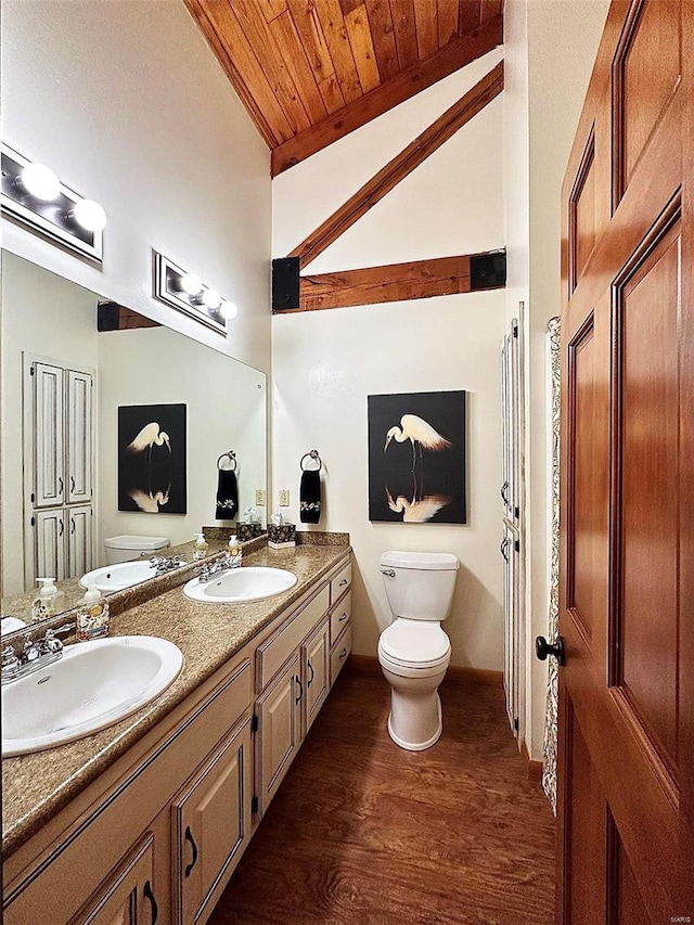 bathroom featuring vanity, lofted ceiling, wood-type flooring, wooden ceiling, and toilet