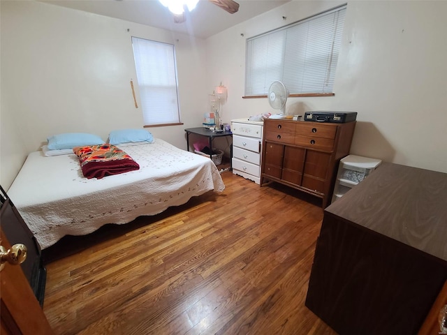 bedroom featuring ceiling fan and hardwood / wood-style floors