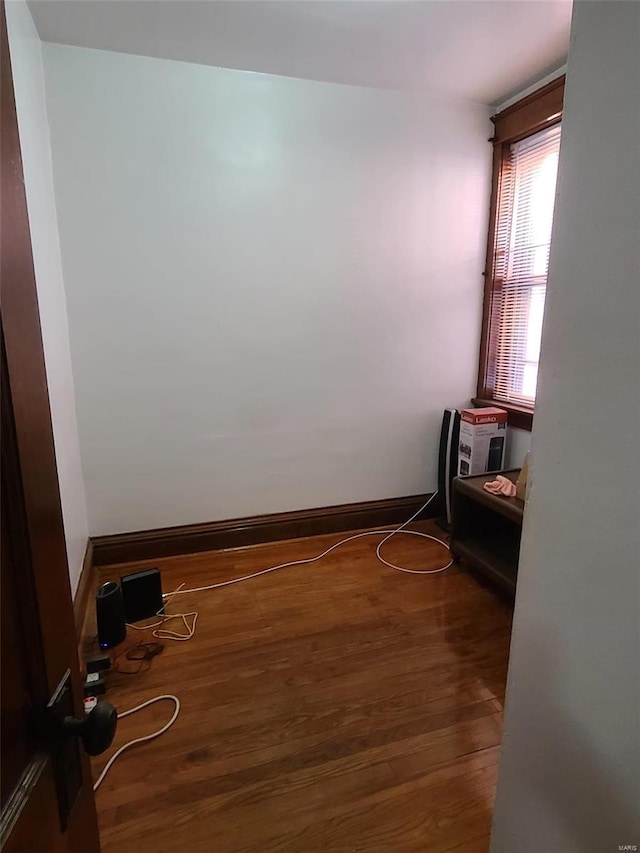 empty room with dark wood-type flooring