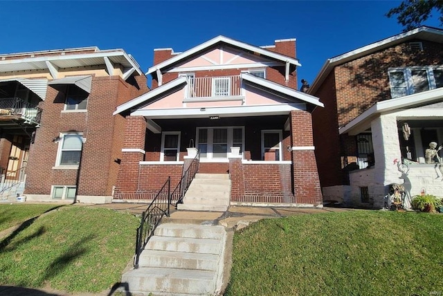 view of front of property with a front lawn and a porch