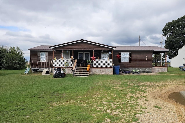 view of front of property with covered porch and a front yard