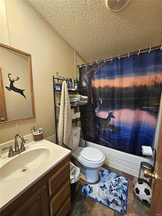 full bathroom featuring vanity, shower / tub combo, toilet, and a textured ceiling