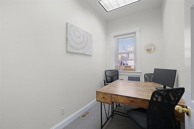 home office with lofted ceiling and carpet flooring