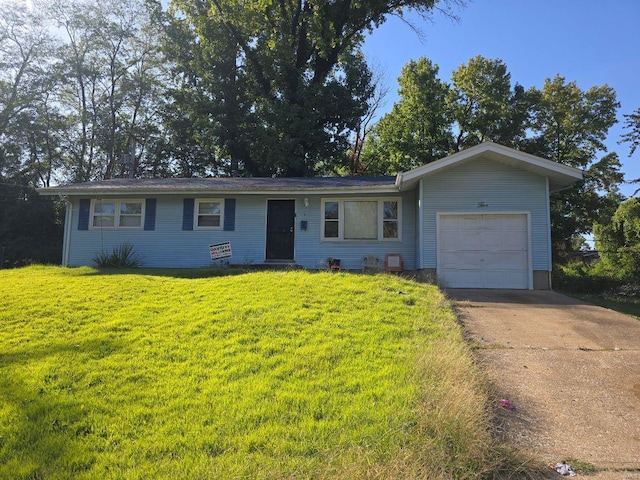 single story home with a front lawn and a garage