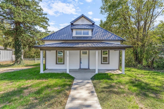 view of front of home featuring a front lawn and a porch