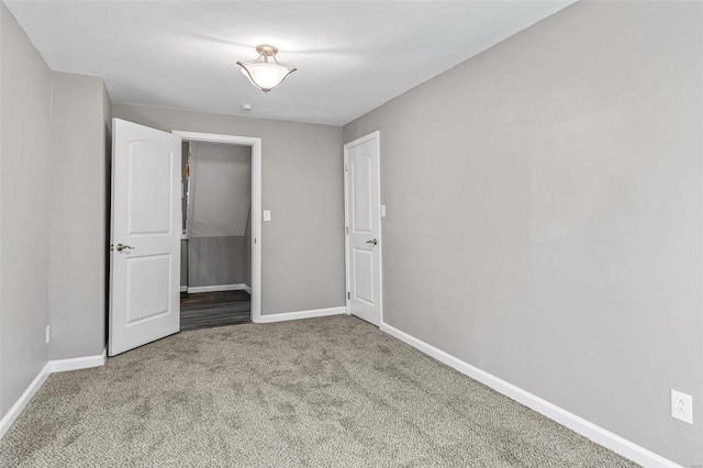 unfurnished bedroom featuring carpet floors