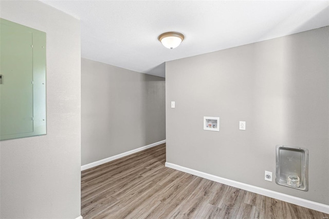 empty room featuring light hardwood / wood-style flooring and electric panel