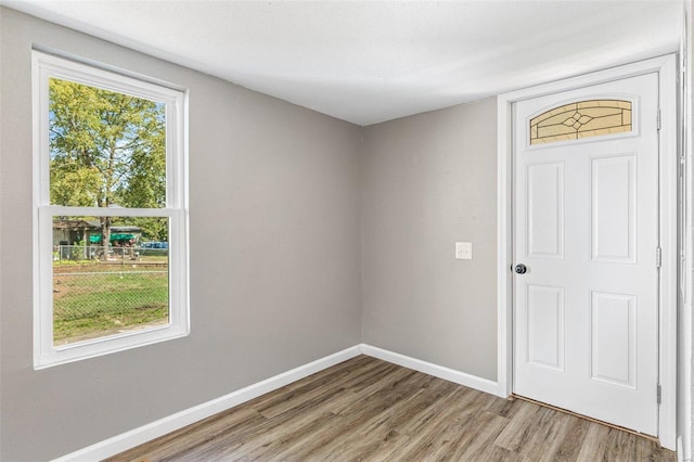 empty room with a textured ceiling and hardwood / wood-style floors