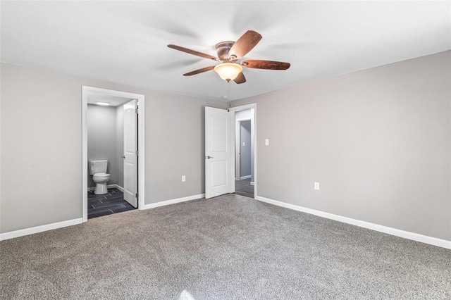 unfurnished bedroom with ceiling fan, ensuite bathroom, and carpet