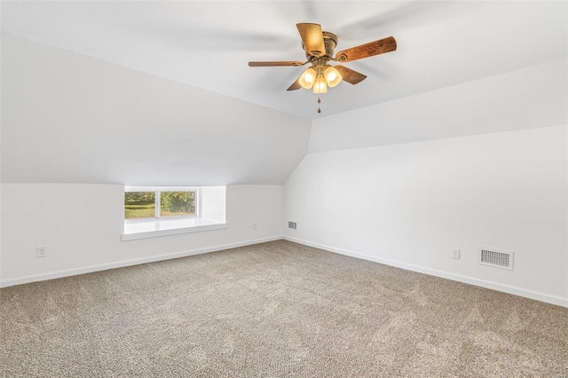 additional living space with carpet floors, vaulted ceiling, and ceiling fan