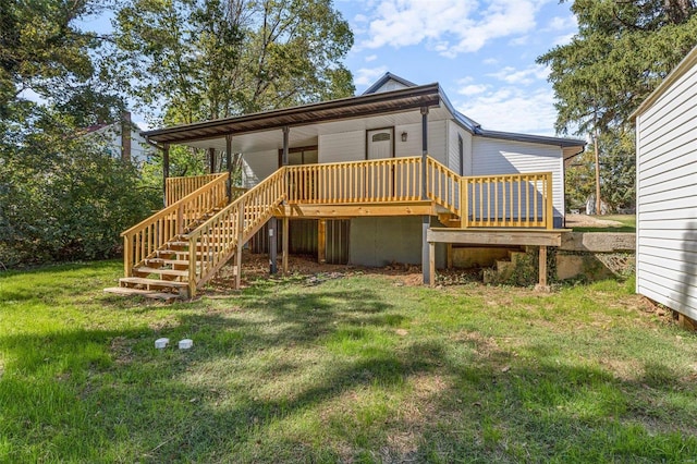 rear view of house featuring a lawn