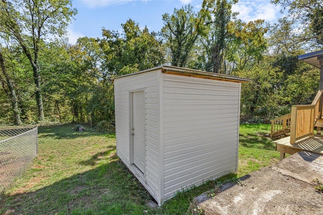 view of outbuilding featuring a yard