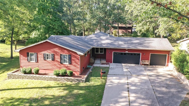 ranch-style home featuring a garage and a front lawn