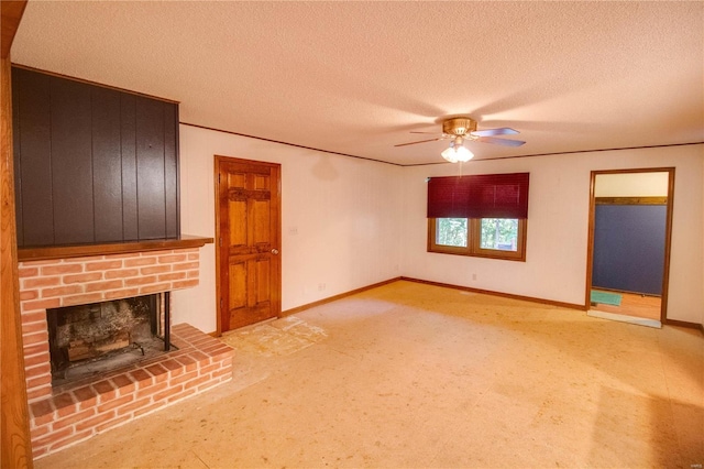 unfurnished living room featuring carpet flooring, a brick fireplace, a textured ceiling, and ceiling fan