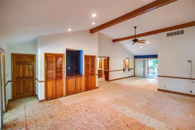 unfurnished living room featuring ceiling fan and lofted ceiling with beams