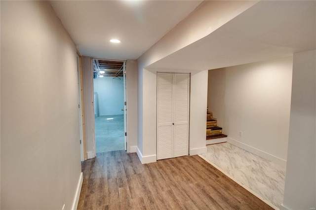 corridor with wood-type flooring