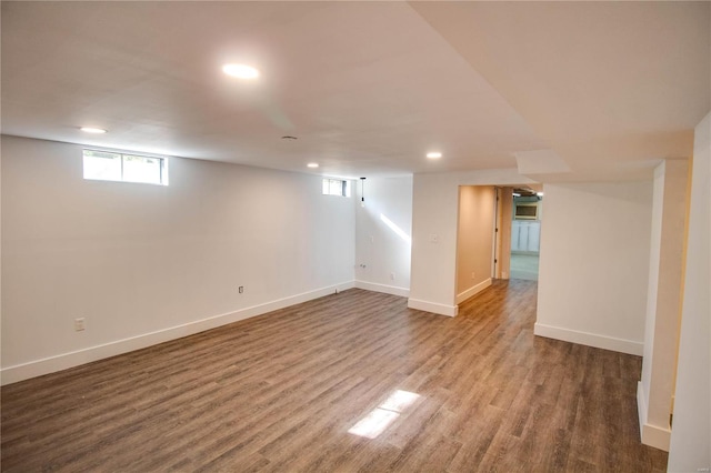 basement with hardwood / wood-style flooring