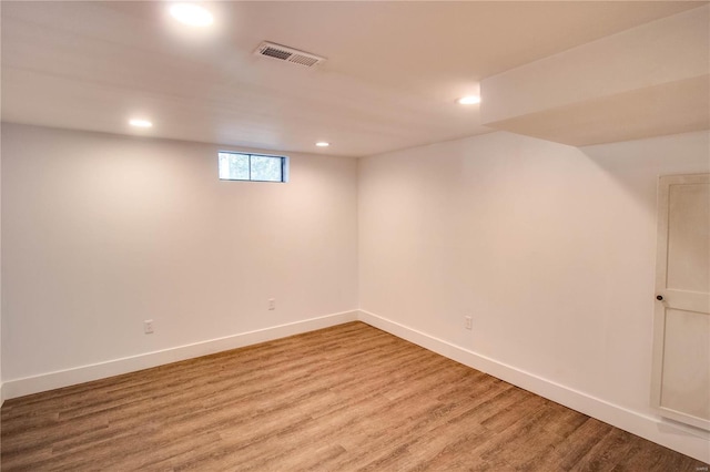 basement featuring hardwood / wood-style flooring