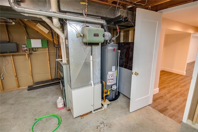 utility room featuring gas water heater and heating unit