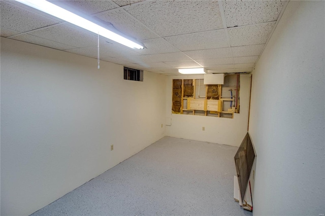 basement featuring a drop ceiling