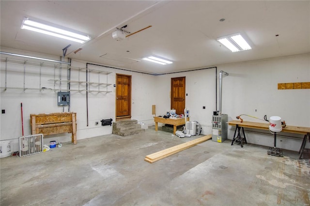 garage featuring electric panel and a garage door opener