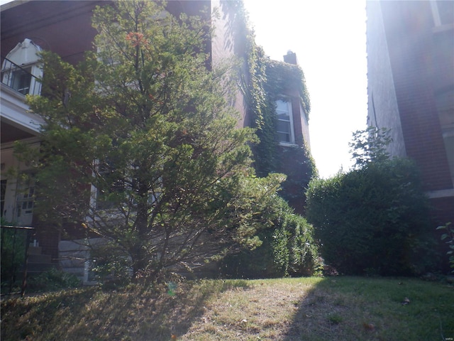 view of property exterior featuring a balcony